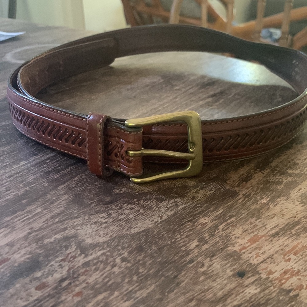 Leather belt, 38 inches. Brass coloured buckle.